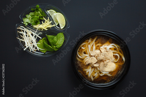 Vietnamese Fo-Bo soup with rice noodles and chicken photo