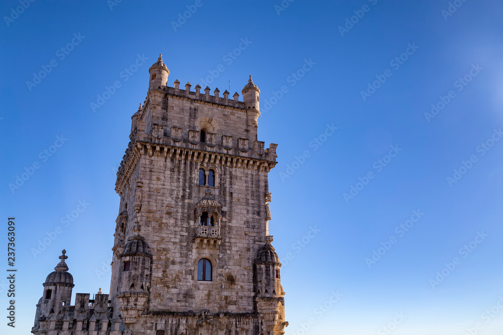 Fototapeta premium Detail of Belem tower and blue sky in the summer in Lisbon, Portugal.
