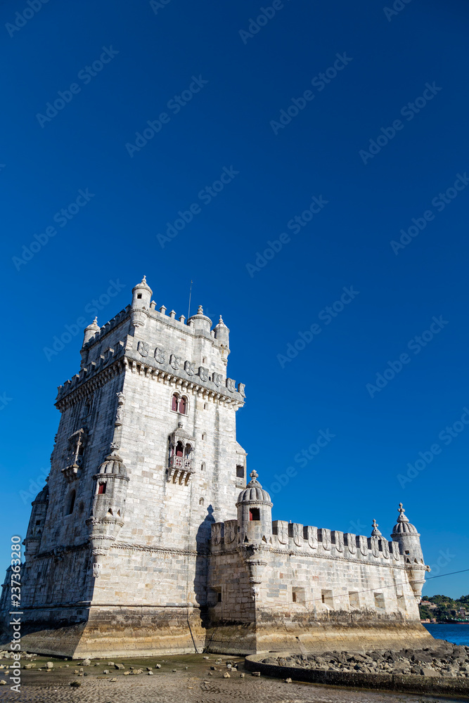 Beautiful blue summer sky over Belem Tower in Lisbon, Portugal.