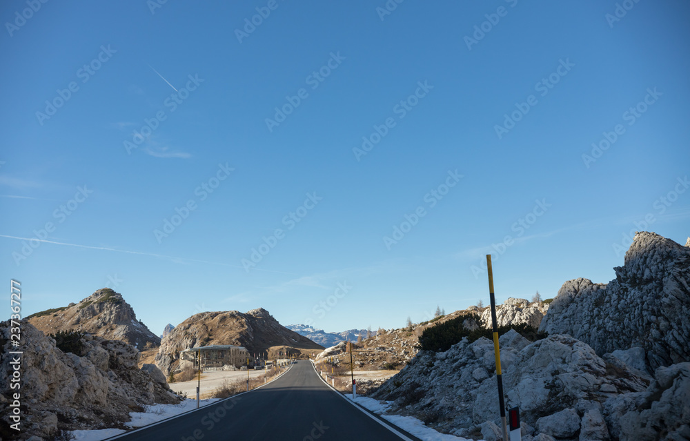 Traveling. An empty road surrounded by rocky area