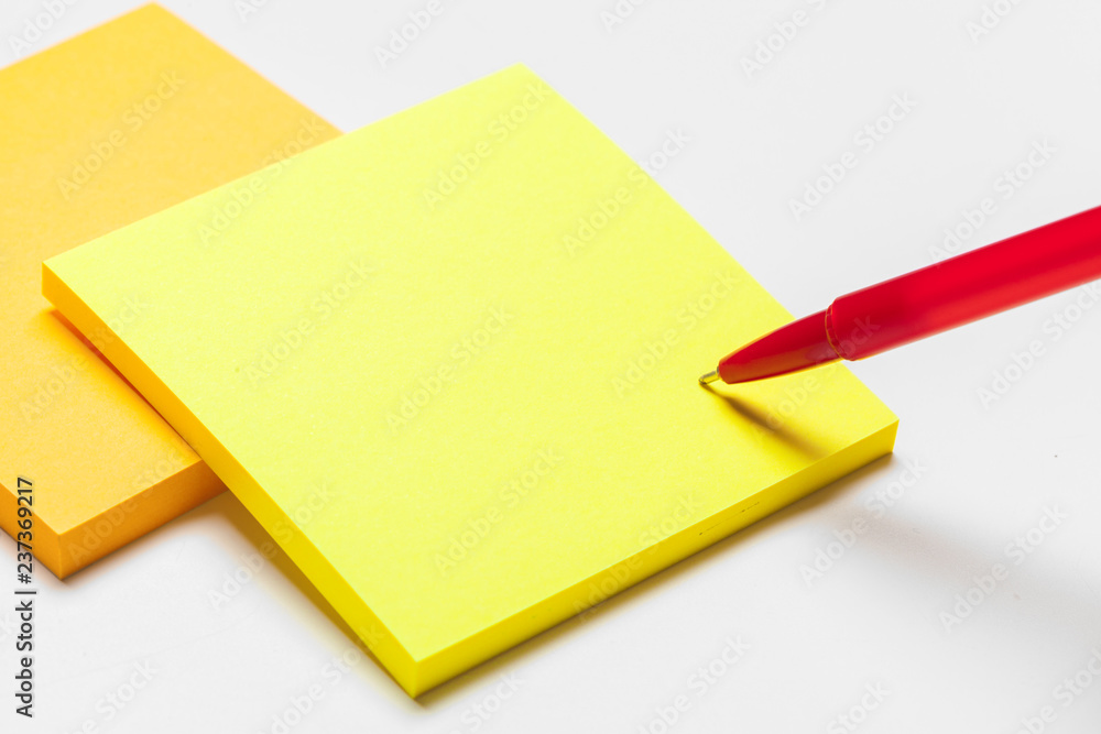 Blank memo pad note with pen close up Blank memo pad note with pen close up