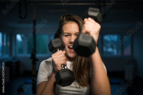 Fitness training with dumbbells, healthy active female © Luka