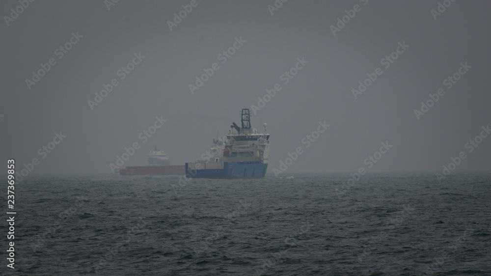 ships;boats;vessel;sea;water;waves;fog;