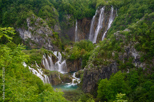 Massive waterfall among lush foliage