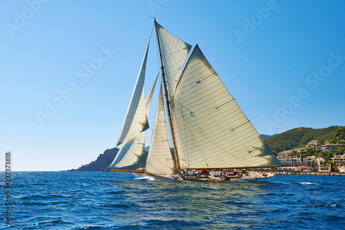 Sailboat under white sails at the regatta. Sailing yacht race © Alvov