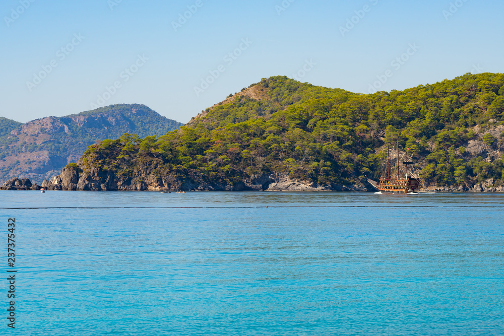 Turquoise waters of the Mediterranean Sea surrounded by rocky shores