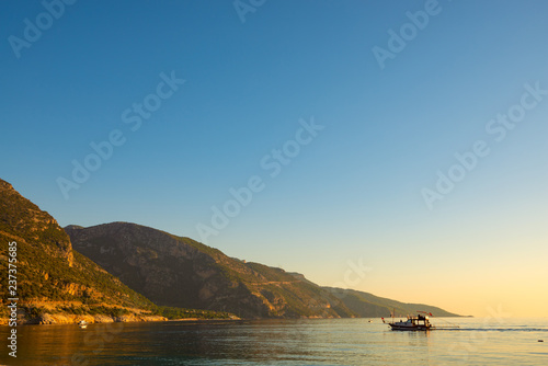 Powerboats and sailboats in turquoise waters of the Mediterranean Sea