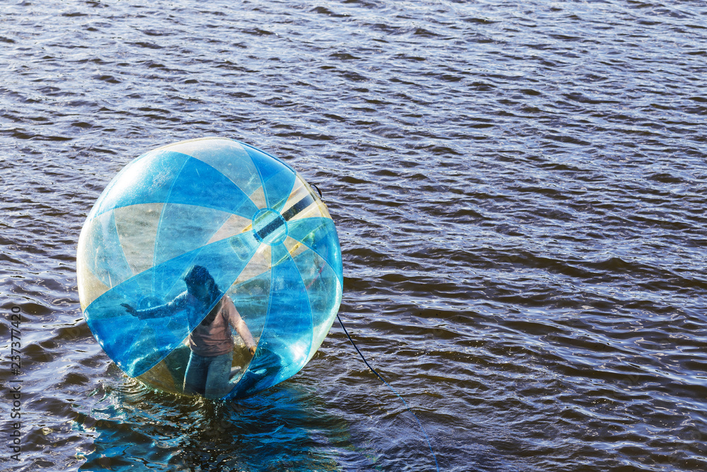 Φωτογραφία Water ball (similar to zorb or Human Hamster Ball) with person inside on river surface