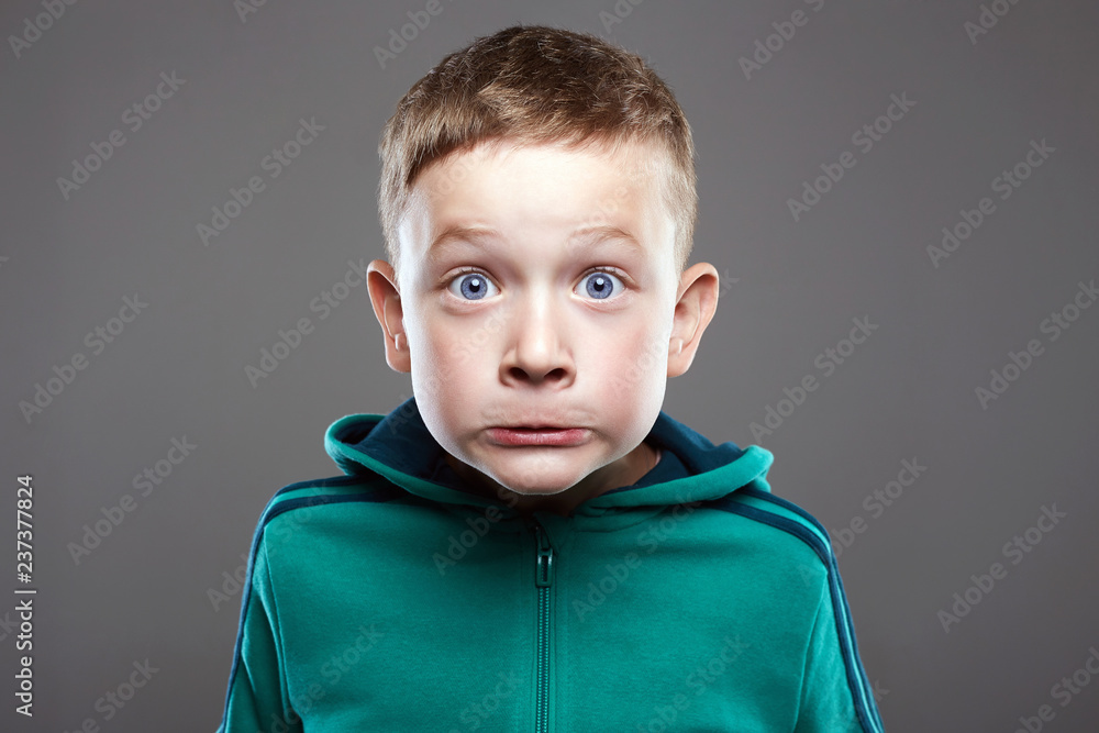 Funny kid. little boy. ugly grimace child Stock Photo | Adobe Stock