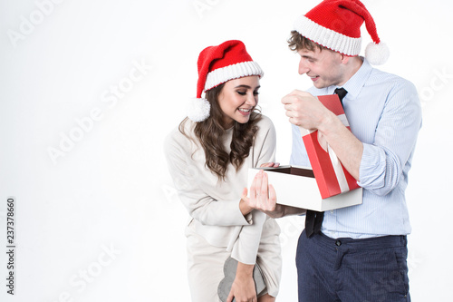 Happy couple open gift box over white background.