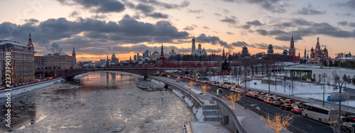 panoramic view of Moscow Kremlin and Moscow river with street illumination at sunset