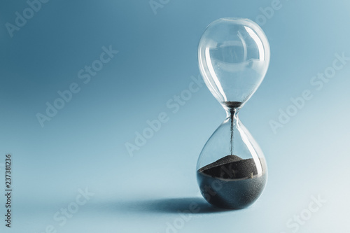 Hourglass on blue background