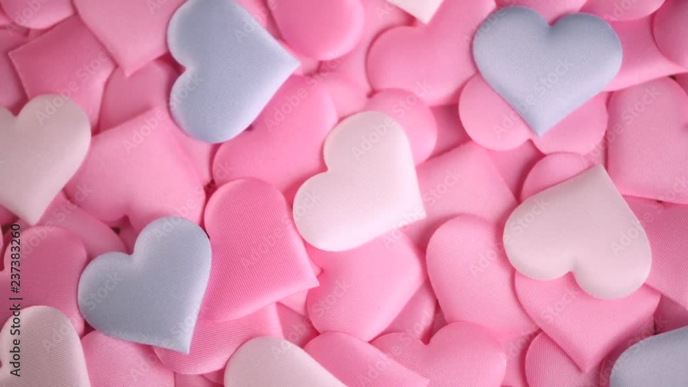 Valentine's Day. Holiday Valentine background with satin pink hearts. Rotated heart shape backdrop. 4K UHD video footage. 3840X2160 Valentine's Day. Holiday Valentine background with satin pink hearts. Rotated heart shape backdrop. 4K UHD video footage. 3840X2160