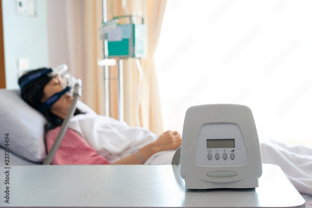 Obstructive sleep apnea therapy..Cpap machine is treating senior