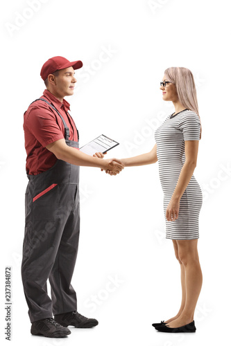 Young woman shaking hands with a mover