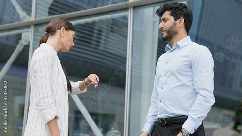 Business People Near Office Ending Meeting With Shaking Hands  photo