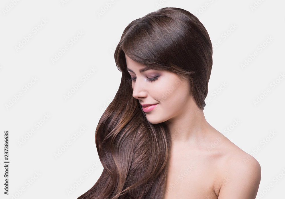 Studio portrait of a beautiful young woman with brown hair. Pretty model girl with perfect fresh clean skin. Beauty and skin care concept Studio portrait of a beautiful young woman with brown hair. Pretty model girl with perfect fresh clean skin. Beauty and skin care concept