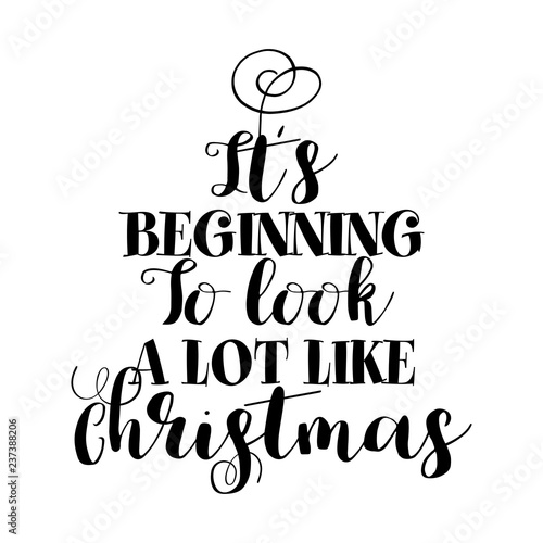 "It's Beginning to look a lot like Christmas" - Calligraphy phrase for Christmas. Hand drawn lettering for Xmas greetings cards, invitations. Good for t-shirt, mug, scrap booking, gift, printing press