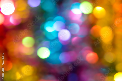 Beautiful multicolored bokeh lights holiday glitter background for Christmas New Year Birthday celebration. High resolution image. Template for backdrop product surface design