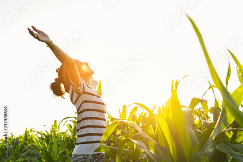 women standing a outdoor with sunset light in countryside for relaxing in field
