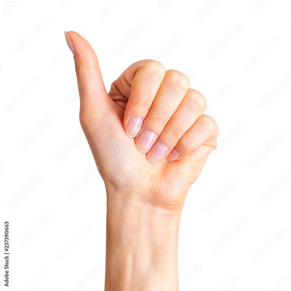 Woman holding hand in gesture of like sign, giving thumb up Woman holding hand in gesture of like sign, giving thumb up