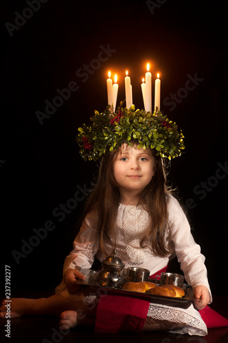 Little caucasian girl in Saint Lucia costume