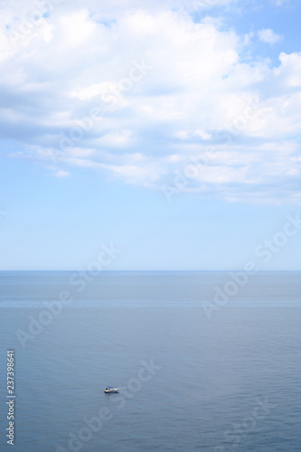 Little boat in the blue sea © Sergey Terentyev