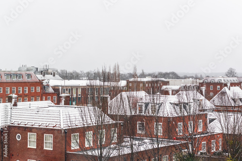 House roofs covered in snow in Welwyn Garden City, Hertfordshire, England photo