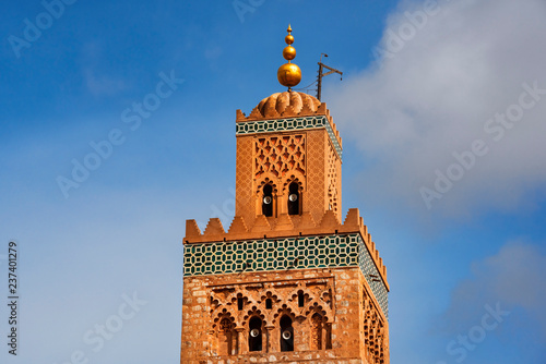 Koutubia mosque largest in Marakech. One of most popular landmarks of Morocco. Ornamented with curved windows, a band of ceramic inlay, pointed merlons, and decorative arches photo