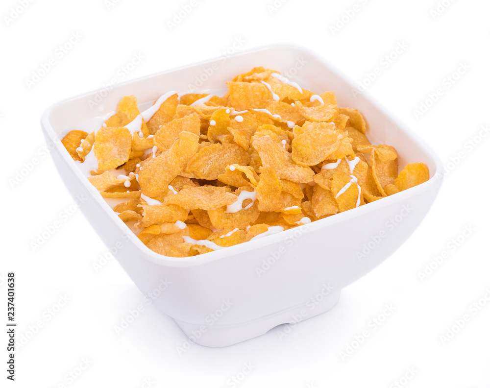 Corn flakes with milk in bowl isolated on white Corn flakes with milk in bowl isolated on white