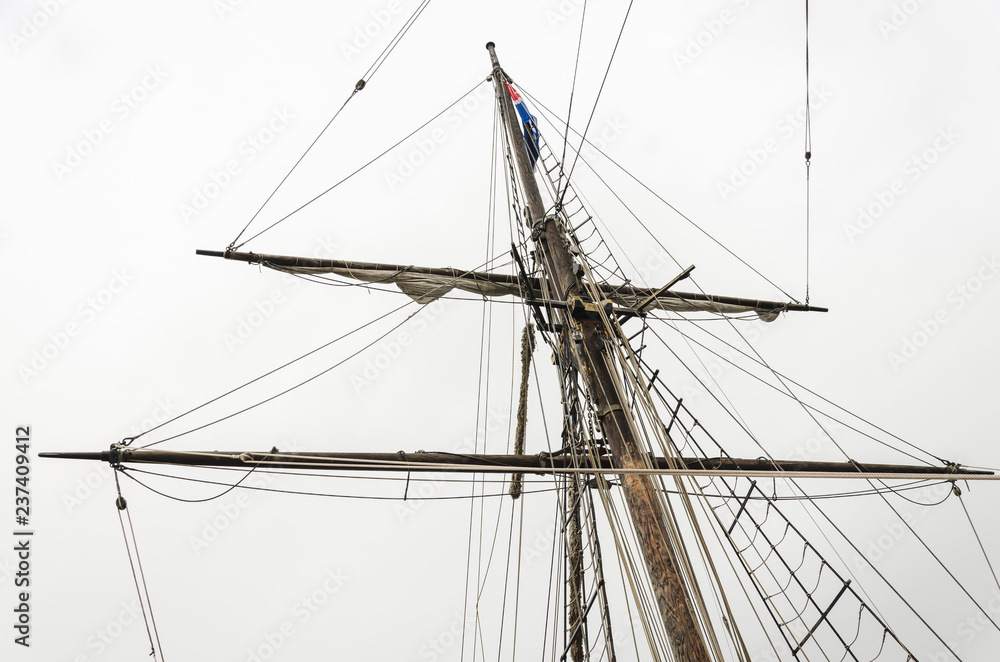 Big mast and and ropes of the of a big old sailship Big mast and and ropes of the of a big old sailship