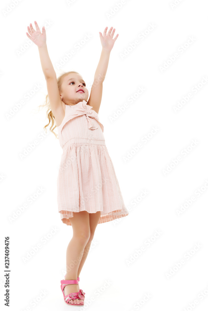 Little girl in a dress developing in the wind. Little girl in a dress developing in the wind.