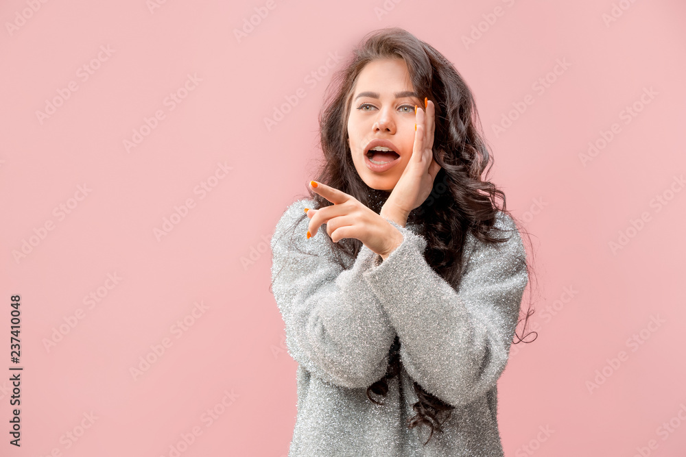 Secret, gossip concept. Young woman whispering a secret behind her hand. Business woman isolated on trendy pink studio background. Young emotional woman. Human emotions, facial expression concept. Secret, gossip concept. Young woman whispering a secret behind her hand. Business woman isolated on trendy pink studio background. Young emotional woman. Human emotions, facial expression concept.