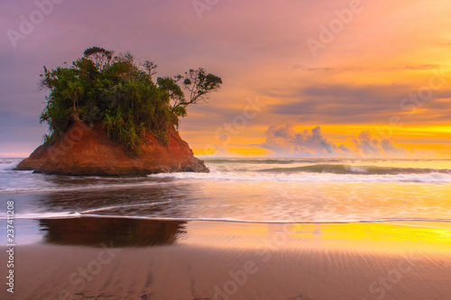 sunset on beach natural beauty of bengkulu utara indonesia with mountain barisan and green nature photo