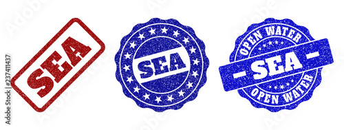 SEA scratched stamp seals in red and blue colors. Vector SEA marks with grunge effect. Graphic elements are rounded rectangles, rosettes, circles and text titles. Designed for rubber stamp imitations.