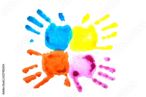 Four colorful child's handprints isolated on white. World autism awareness day concept.