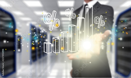 Businessman and analytics symbols on blurred background