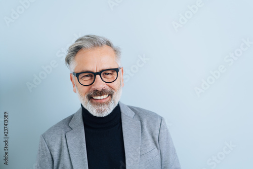 Happy friendly bearded man wearing glasses © contrastwerkstatt