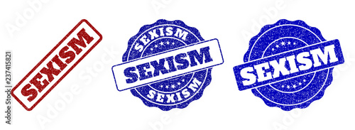 SEXISM grunge stamp seals in red and blue colors. Vector SEXISM labels with scratced effect. Graphic elements are rounded rectangles, rosettes, circles and text labels.
