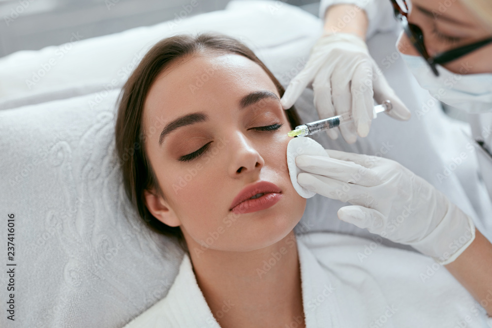 Cosmetology Procedure. Woman Receiving Face Skin Lift Injections