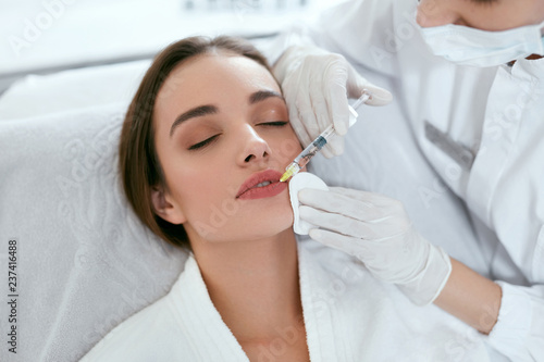 Lip Augmentation. Woman Getting Beauty Injection For Lips photo