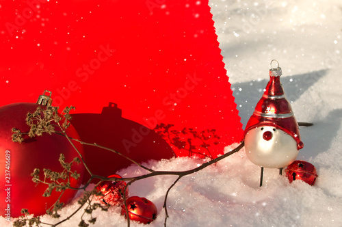 Red paper greeting card in snow with beautiful Christmas decorations