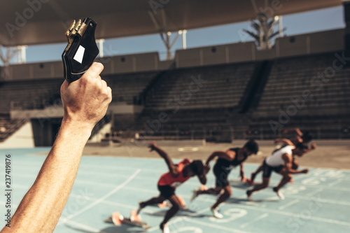 Obraz na plátne Athletes running a race in a track and field stadium