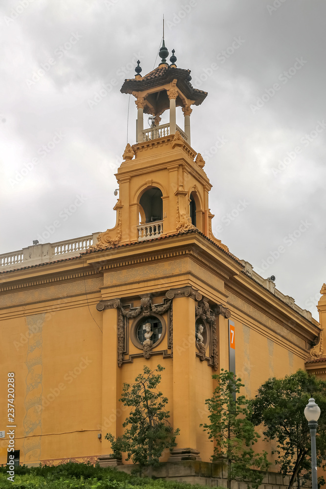 Yellow building with a tower in Montjuic Park