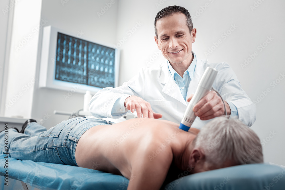 Handsome medical worker using modern equipment Handsome medical worker using modern equipment