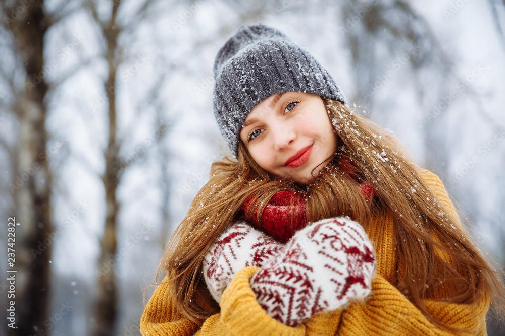 Winter young woman portrait. Beauty Joyful Model Girl laughing and having fun in winter park. Beautiful young female outdoors, Enjoying nature, wintertime Winter young woman portrait. Beauty Joyful Model Girl laughing and having fun in winter park. Beautiful young female outdoors, Enjoying nature, wintertime