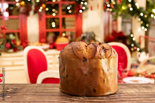 Delicious chocolate panettone with blurred christmas background