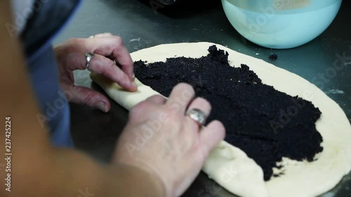Preparing homemade pie, roll with poppy seeds. Cooking process, sweet tooth, delicious.Being a gourmet, chef.Handmade, tasty sweets. Close up view, slow motion