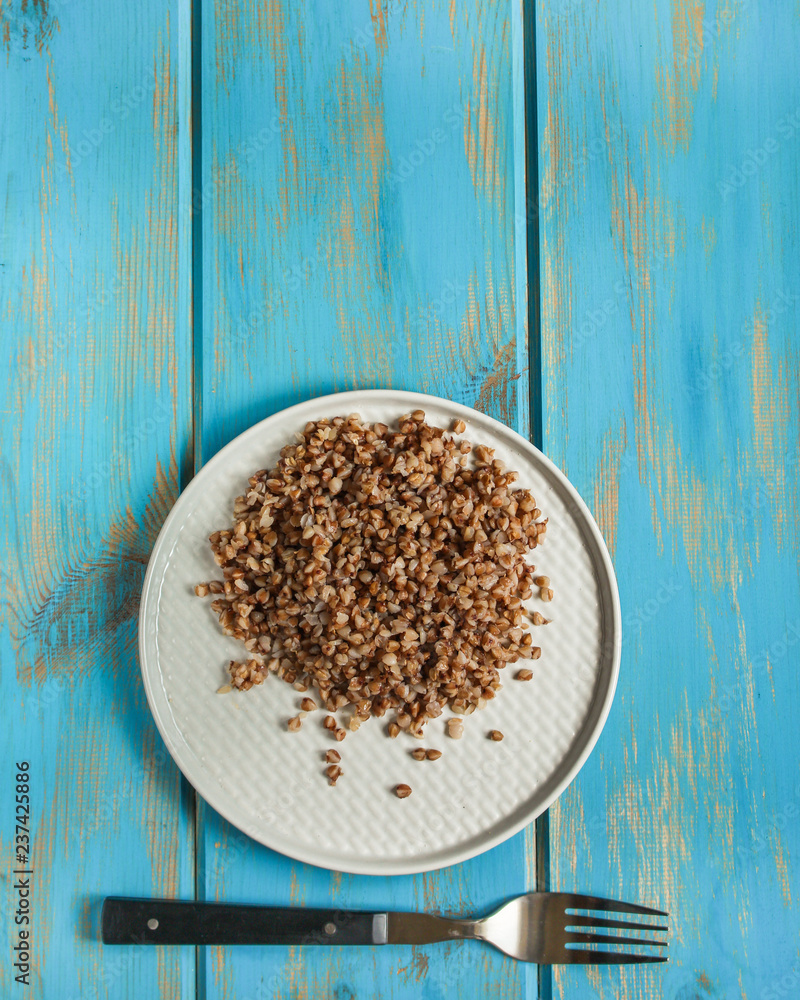 buckwheat, Bowl of tasty porridge on wooden table, top view. copy space buckwheat, Bowl of tasty porridge on wooden table, top view. copy space
