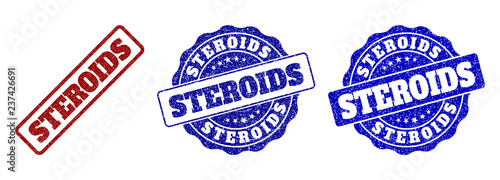 STEROIDS grunge stamp seals in red and blue colors. Vector STEROIDS watermarks with grunge texture. Graphic elements are rounded rectangles, rosettes, circles and text captions.